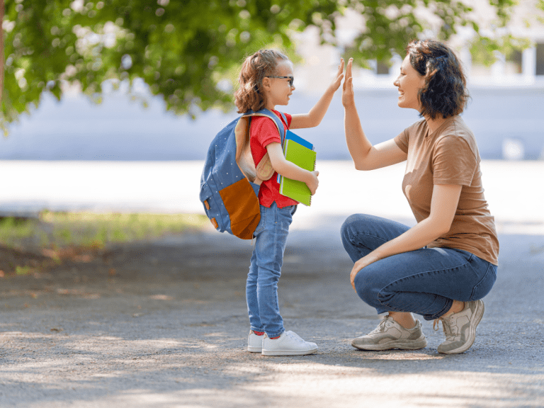 mom giving her daughter a high five