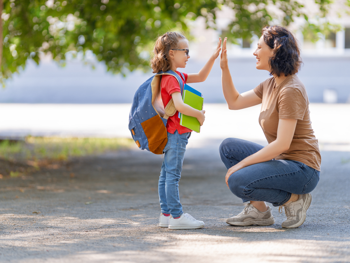 mom giving her daughter a high five