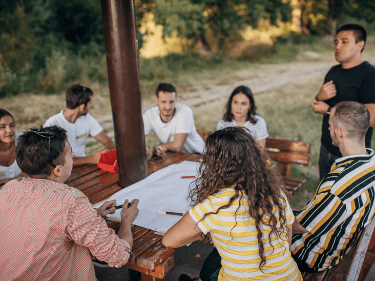 youth ministry volunteers talking together at a table