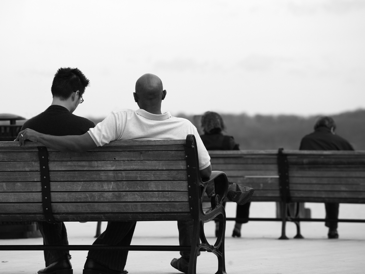 two friend sitting on a bench