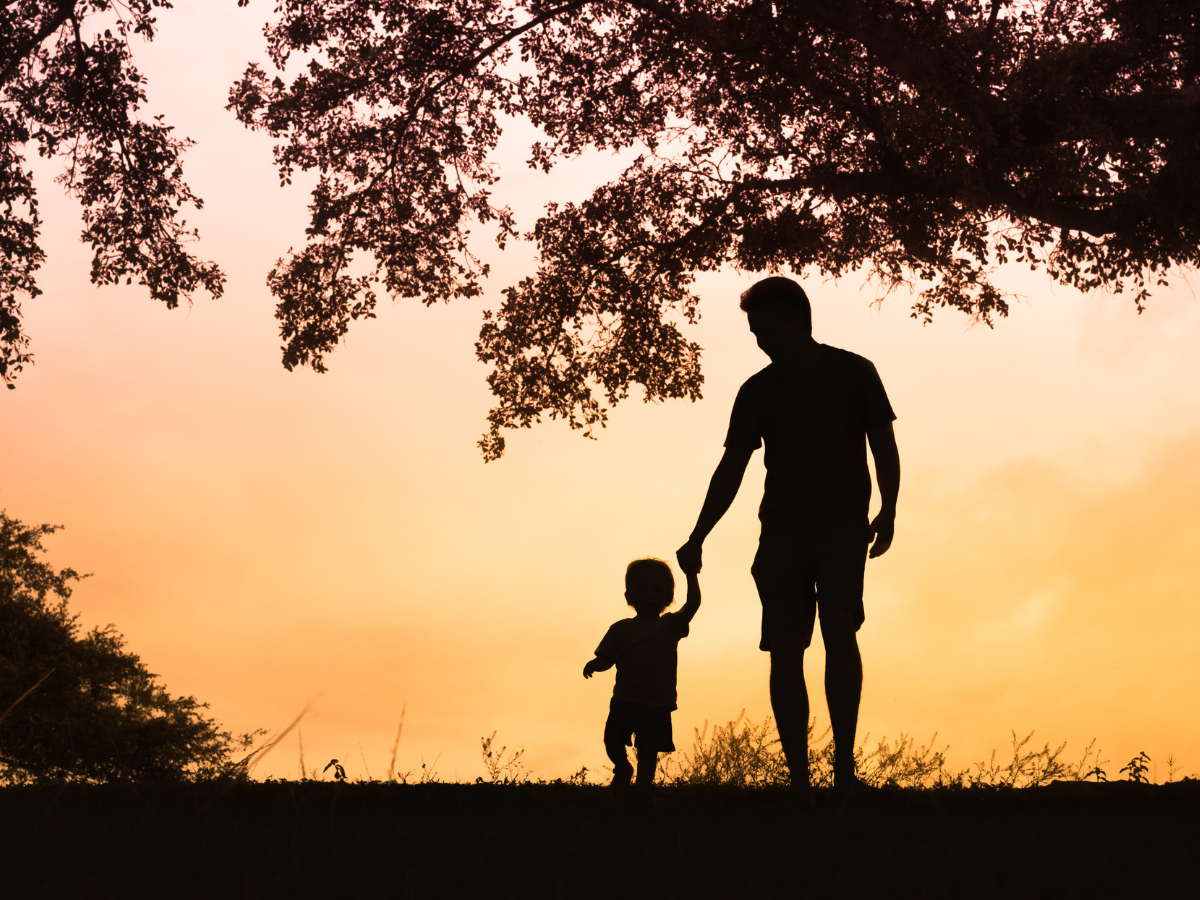 dad holding his son's hand