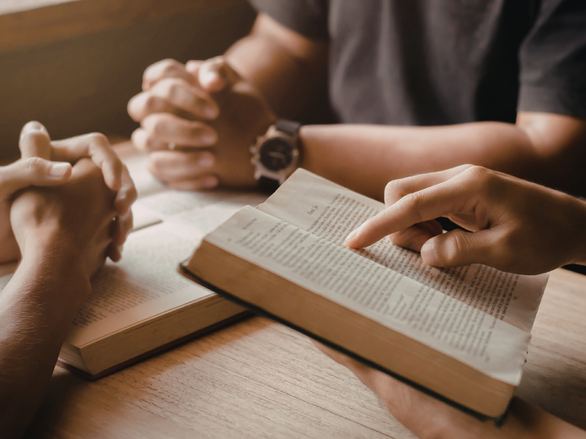 people praying and reading the bible